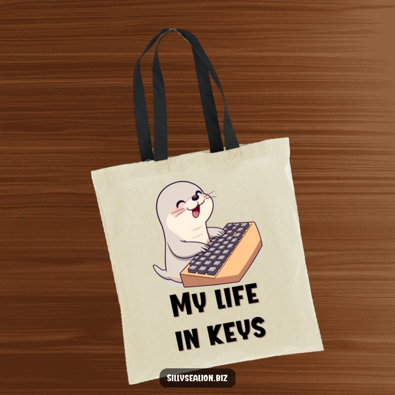 Funny sea lion tote bag showcasing a cute sea lion character furiously typing on a massive keyboard, great for techies.